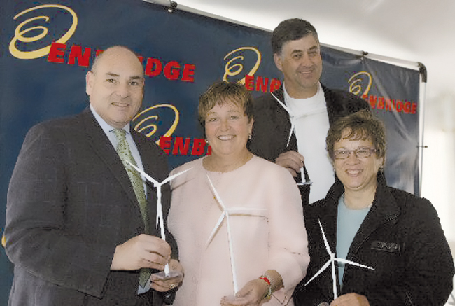 The Honourable George Smitherman, Minister of Energy and Infrastructure (left), celebrates the opening of Enbridge Ontario Wind Power near Kincardine, Friday, April 3, 2009. Joining him are Janet Holder, President Enbridge Gas Distribution (far right); Carol Mitchell, M.P.P. Huron-Bruce; and Kincardine Mayor Larry Kraemer. Marketwire Photo/Enbridge Inc