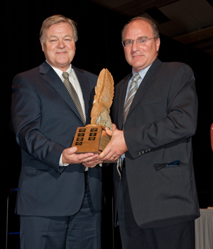 Finn Greflund, left, receives the Hedley Palmer award from APPrO chair Sam Mantenuto. Photo: David Smiley