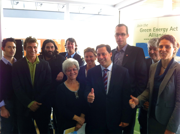 Celebrating the first 18 months of the GEA. L to R: Adrian and Julian Sakamoto, Solgate/Sentinel; Jim Jaeger and David Biderman, Dynamic Solartech; Chief Denise Restoule, Dokis First Nation; Deb Doncaster, Chair, Green Energy Act Alliance; Hon. Brad Duguid, Ontario Minister of Energy; Dr. Rick Smith, Executive Director, Environmental Defence; Don McCabe, Ontario Federation of Agriculture; Judith Lipp, Executive Director, Toronto Renewable Energy Coop. Photo: Erin Charter, Environmental Defence.