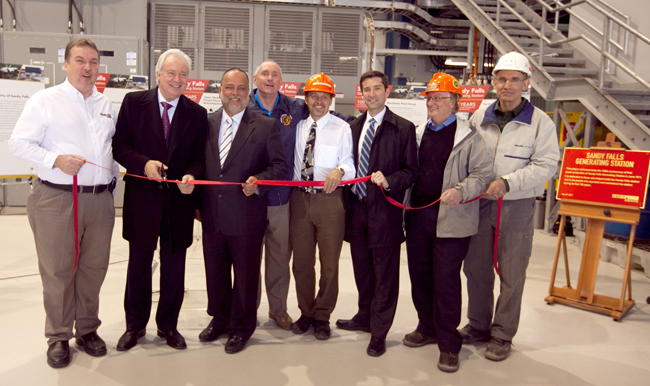 Sandy Falls Ribbon-cutting (L to R): Peter Murray, Plant Group Manager, OPG; John Murphy, Hydro Executive Vice President, OPG; Gilles Bisson, Timmins-James Bay MPP; Tom Laughren, Mayor of Timmins; Ed Dobrowolski, Upper Mattagami Hound Chute Redevelopment Project Manager, OPG; Carlo Crozzoli, Hydro Develepment Vice President, OPG; Dick Jessop, Upper Mattagami Hound Chute Redevelopment Project Director, OPG; Denis Alarie, Kiewit Alarie Partnership (Upper Mattagami Hound Chute Redevelopment Project Design Build Contractor).