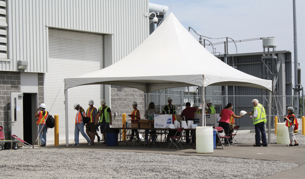 Visitors get a tour of the plant