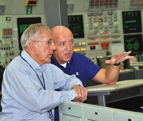 Bruce Power President and CEO Duncan Hawthorne explains the inner workings of a nuclear facility’s Main Control Room to Minister of Energy Hon. Bob Chiarelli during the Minister’s tour of Bruce A on October 7.
