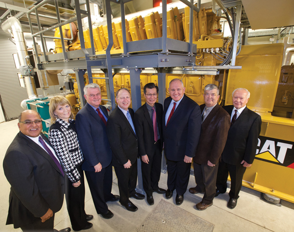 Participants at the opening of Markham’s second district energy system – the first in Canada to have two independent systems. L to R: Khalid Usman, MDE Board Member; JoAnne Butler, Ontario Power Authority Vice President of Electricity Resources; Deputy Mayor Jack Heath, MDE Board Chair; Bruce Ander, MDE President and CEO; Michael Chan, MPP Markham-Unionville; Mayor Frank Scarpitti; Mac Cosburn, Markham Stouffville Hospital Former Vice President Redevelopment; Mark Wolnik, MDE Board Vice-Chair.