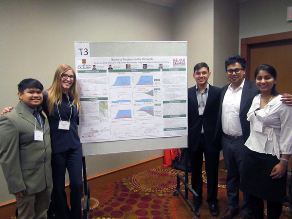 L to R: Students Jiaan Pacunana (chemical engineering), Samantha Visser (mechanincal engineering), Waheed Zaman (chemical engineering), Pradeep Shrestha (chemical engineering) and Varada Khot (chemical engineering) with their poster on “Biomass Pyrolysis in the Oil Sands.”